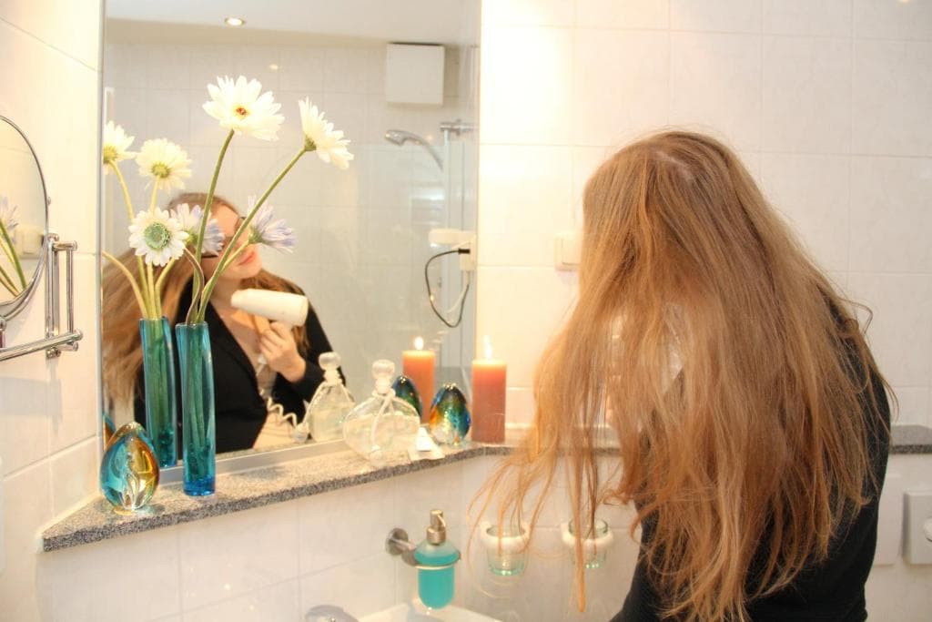 En-suite bathroom with fresh flowers at the vanity